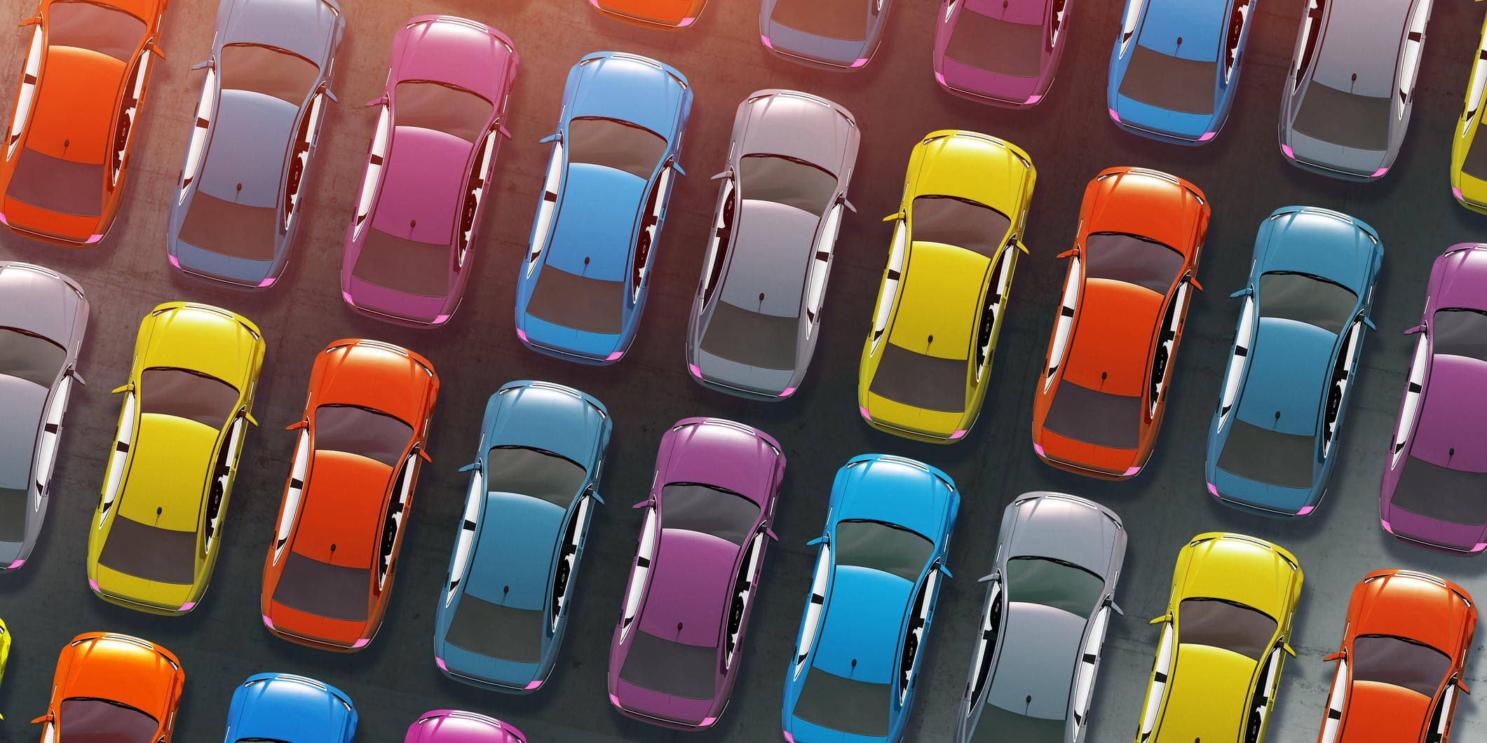 An aerial view of rows of colorful cars 